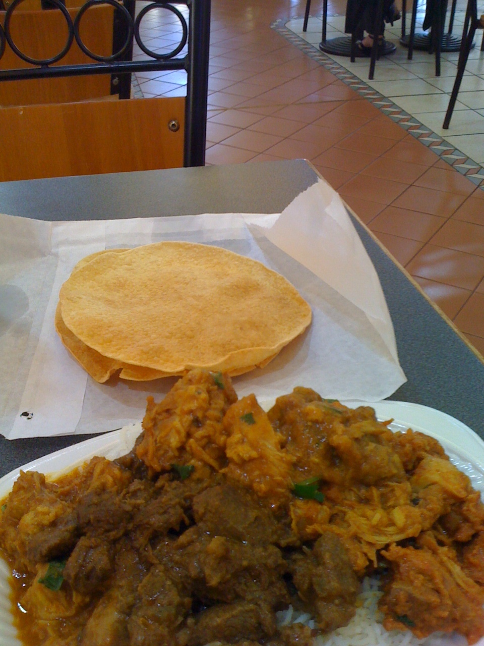 Medium sized dish with choice of three curries and chapatis at an Indian restaurant at the Cairns Night Market.