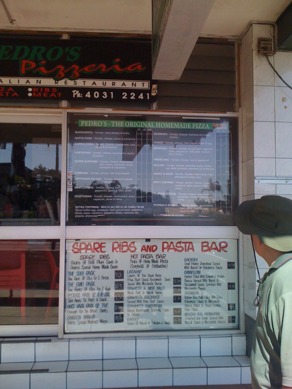 My Dad checks out the menu at Pedros Pizzera in North Cairns.