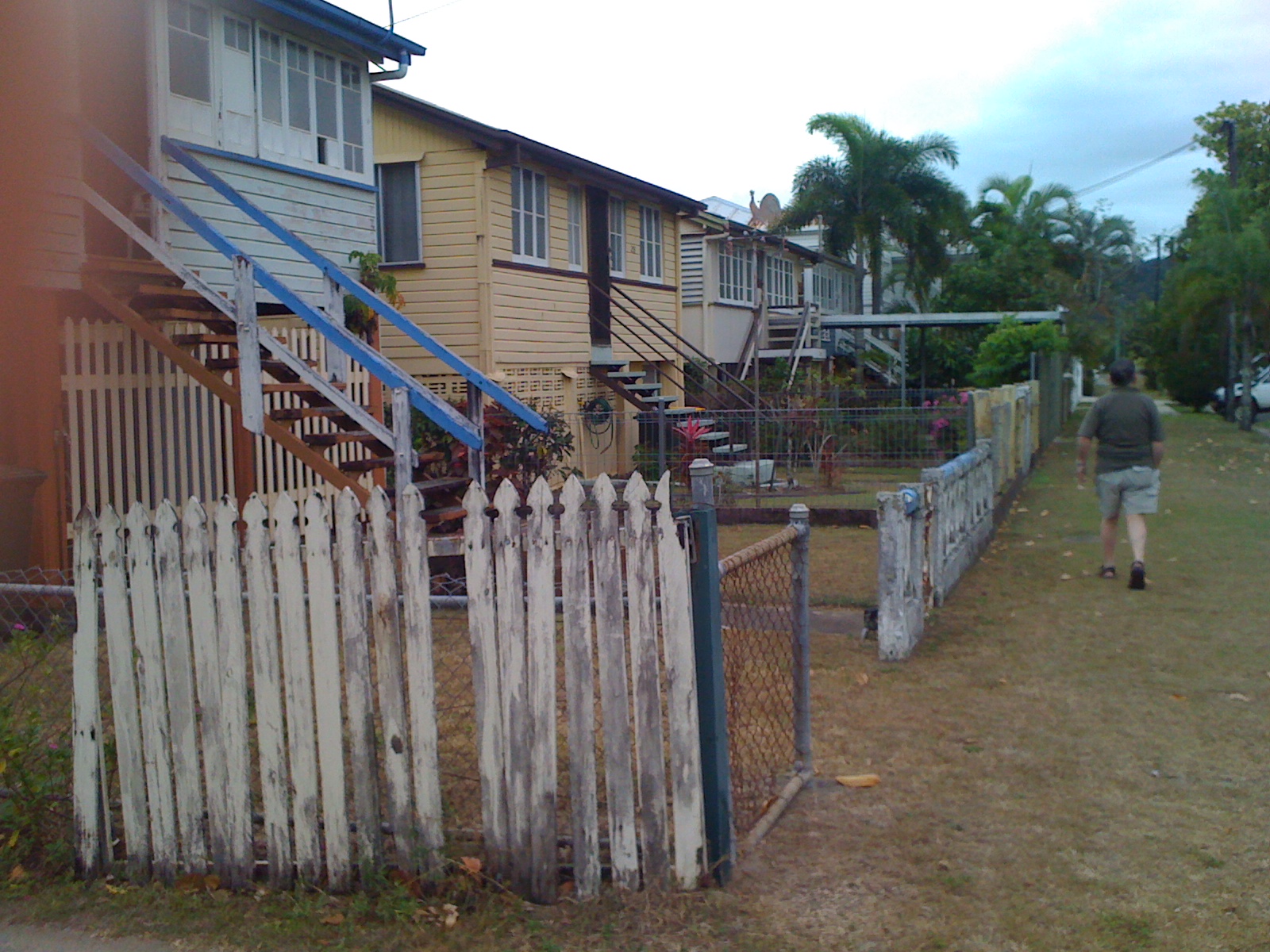 Rustic homes in the Queenslander style, raised off the ground to protect the occupants from floods, in the streets of North Cairns, in Australia.