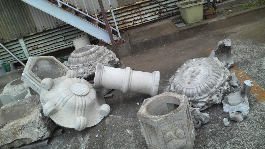 More earthquake damage: some concrete Shinto shrine things smashed outside a real estate agent, just across the road from my flat in Shinozaki, Ichinoe Ward, Tokyo