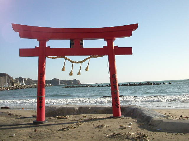The red gate of the torii (literary BIRDS IS or BIRDS ARE HERE) on a beach at Katsuura (literary WIN BAY or VICTORY BAY)