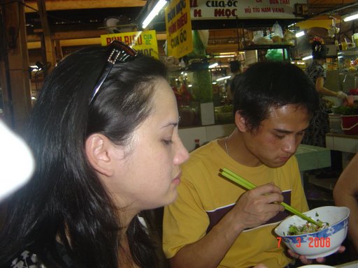 Grilled dog meat and noodles at Saigon's downtown Ben Thanh Market