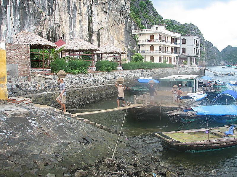 Workers offloading building materials on to Cat Ba Island, in Halong Bay near Haiphong