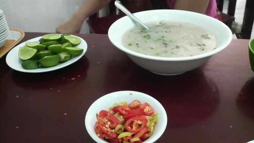 Suitably bland Vietnamese rice porridge, with some chilli and lime to spice it up if that's what you need.