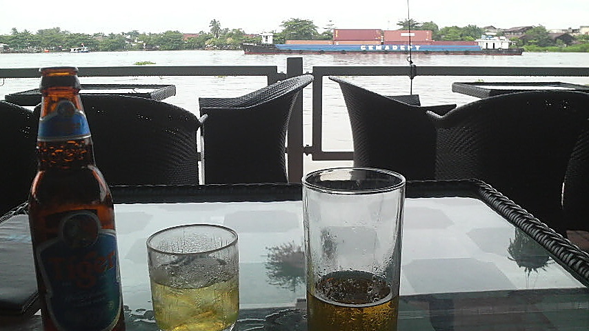 Jasmine tea and ice, Tiger beer, and a view of the container ships passing by