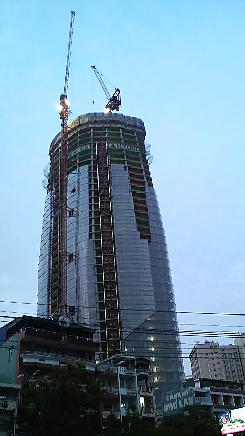 I could be wrong but this seems to be the Bitexco Financial Tower, under construction by Hyundai