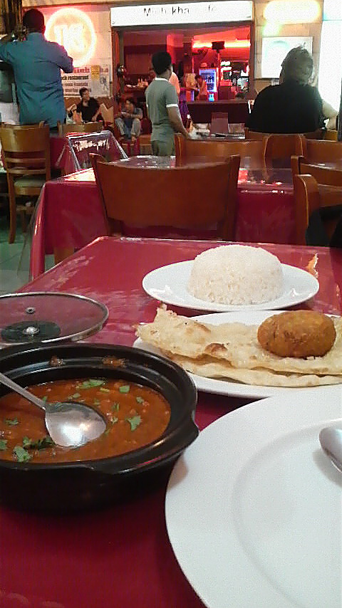 The 100,000 Dong set meal at Mughal: , accompanied by a flaky lacha paratha.