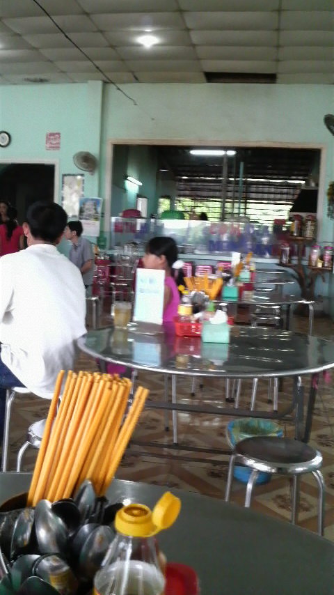 Chopsticks and spoons and silver tabletops and the general decor inside one of the countless noodle bus/truck stops on the road to Phan Thiet