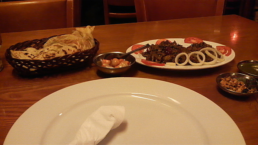 Mutton and pepper dish at Mumtaz, accompanied by a flaky lacha paratha.