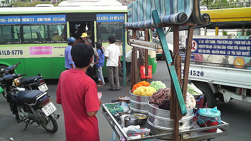 The glorious colors of xoi are displayed in this rice stand, at Ben Thanh Bus Station in downtown Saigon.